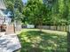 Backyard features lush lawn, wooden fence, and a storage shed at 8312 Bellingham Cir, Raleigh, NC 27615