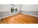 A bright bedroom featuring natural light and neutral paint colors at 8312 Bellingham Cir, Raleigh, NC 27615