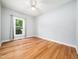 Bright bedroom featuring a ceiling fan, natural light, and neutral paint colors at 8312 Bellingham Cir, Raleigh, NC 27615