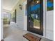 Inviting front porch with a black-trimmed glass door and a 'Welcome Home' mat, offering a warm and friendly entry at 8312 Bellingham Cir, Raleigh, NC 27615