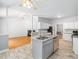 Open-concept kitchen with a large island, stainless steel appliances, granite countertops and bright lighting at 8312 Bellingham Cir, Raleigh, NC 27615
