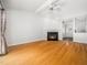 Bright living room with hardwood floors, fireplace and high ceilings at 8312 Bellingham Cir, Raleigh, NC 27615