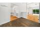 Open-concept living space featuring hardwood flooring that connects multiple rooms with lots of natural light at 8312 Bellingham Cir, Raleigh, NC 27615