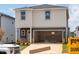 Two-story home with a spacious two-car garage and grey and white siding and well manicured lawn at 832 Ottawa Dr, Garner, NC 27529