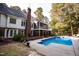 Backyard featuring an in-ground pool and view of the house with a screened-in porch at 9200 Lake Carol Dr, Zebulon, NC 27597