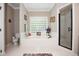 Bright bathroom featuring a soaking tub with glass block window, and a walk-in shower with a glass enclosure at 9200 Lake Carol Dr, Zebulon, NC 27597