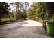 Long driveway with basketball hoops on each side of the road at 9200 Lake Carol Dr, Zebulon, NC 27597
