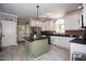 Spacious kitchen with white cabinets, center island, and stainless steel appliances at 9200 Lake Carol Dr, Zebulon, NC 27597