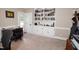 Spacious office with built in bookshelves and storage cabinets at 9200 Lake Carol Dr, Zebulon, NC 27597
