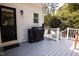 Outdoor patio area with a Traeger grill, and white railing, perfect for entertaining at 9200 Lake Carol Dr, Zebulon, NC 27597