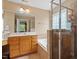 Bathroom features a tiled tub and shower, and a single wood vanity with white sink at 933 Richland Ridge Dr, Wake Forest, NC 27587