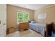 Bedroom featuring a window, bed, dresser, and a whiteboard at 933 Richland Ridge Dr, Wake Forest, NC 27587