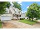 Beautiful two-story home with lush green lawn, mature trees, and a two-car garage at 933 Richland Ridge Dr, Wake Forest, NC 27587