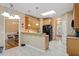 Spacious kitchen with granite countertops, stainless steel appliances, and tile flooring at 933 Richland Ridge Dr, Wake Forest, NC 27587