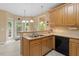 Kitchen with light wood cabinets, stainless steel appliances, and tile flooring at 933 Richland Ridge Dr, Wake Forest, NC 27587
