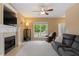 Bright living room with a fireplace, large windows, and comfortable seating arrangement at 933 Richland Ridge Dr, Wake Forest, NC 27587