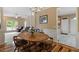 Open-concept living room with wood floors, a fireplace, and natural light at 933 Richland Ridge Dr, Wake Forest, NC 27587