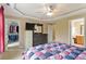 Main bedroom featuring ceiling fan, walk-in closet, and access to the ensuite bathroom at 933 Richland Ridge Dr, Wake Forest, NC 27587