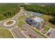 Stunning aerial view of community amenities: pool, tennis courts, and clubhouse at 1002 Gilly Ct, Durham, NC 27703