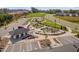 Aerial view showcases community garden, playground, and ample parking at 1002 Gilly Ct, Durham, NC 27703