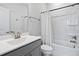 Well-lit bathroom with a shower-tub combination, modern fixtures, and a neutral color palette at 1002 Gilly Ct, Durham, NC 27703