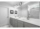 Bathroom features double vanity, framed mirrors, and tile floor at 1002 Gilly Ct, Durham, NC 27703