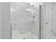 Bathroom features a glass enclosed tiled shower with a bench and shower niche at 1002 Gilly Ct, Durham, NC 27703