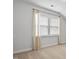 Bedroom with natural light streaming through window with flowing curtains at 1002 Gilly Ct, Durham, NC 27703