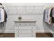 Dresser with drawers in a walk in closet with white wire shelving at 1002 Gilly Ct, Durham, NC 27703