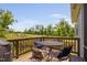 Outdoor deck with a dining table and chairs, perfect for enjoying scenic views and al fresco dining at 1002 Gilly Ct, Durham, NC 27703