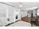 A bright sunroom with hardwood floors, a comfortable seating area, and access to the backyard at 1002 Gilly Ct, Durham, NC 27703
