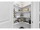 Walk-in pantry featuring built in shelving for organized storage of food items and household goods at 1002 Gilly Ct, Durham, NC 27703