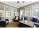 Comfortable screened porch with stylish seating, a cozy ambiance, and a peaceful retreat at 1002 Gilly Ct, Durham, NC 27703