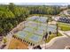 Aerial view of community tennis and pickleball courts with professional lighting at 1002 Gilly Ct, Durham, NC 27703