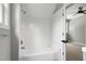 Bright bathroom with a subway tiled shower and access to the bedroom at 1003 E Sterlington Pl, Apex, NC 27502