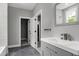 Well-lit bathroom with modern vanity and fixtures, as well as an open view to the shower/bath at 1003 E Sterlington Pl, Apex, NC 27502