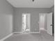 Bedroom with neutral paint and doors leading to bathroom and bedroom at 1003 E Sterlington Pl, Apex, NC 27502