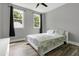 Cozy bedroom with black out curtains, windows, hardwood floors and soft bed linens at 1003 E Sterlington Pl, Apex, NC 27502