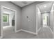 Hallway showing access to bath and bedroom with lots of natural light at 1003 E Sterlington Pl, Apex, NC 27502