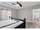 The main bedroom features hardwood floors, recessed lighting and a barn door to the bathroom at 1003 E Sterlington Pl, Apex, NC 27502