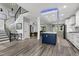 The open floorplan is complimented by modern design, kitchen with an island, and an open staircase at 1003 E Sterlington Pl, Apex, NC 27502