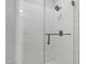 Luxurious stand up shower with textured white tiles and stylish shower head and handle at 1003 E Sterlington Pl, Apex, NC 27502