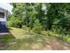 Spacious lot with a wooded tree line bordering the property for ultimate privacy at 1003 E Sterlington Pl, Apex, NC 27502