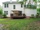 Spacious backyard with a well-maintained deck and gazebo, perfect for enjoying the outdoors at 1010 Starita Ct, Apex, NC 27502