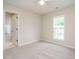 Cozy bedroom featuring carpet flooring, ceiling fan, and an ensuite bathroom at 1010 Starita Ct, Apex, NC 27502