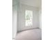Walk-in closet featuring shelving and a window providing natural light at 1010 Starita Ct, Apex, NC 27502