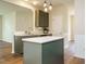 Eat-in kitchen featuring modern island and stainless steel sink at 1010 Starita Ct, Apex, NC 27502