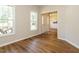 Open living area with hardwood floors leading to the entryway at 1010 Starita Ct, Apex, NC 27502