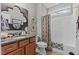 Well-appointed bathroom with a vanity, decorative mirror, and shower-tub combination at 1012 Autumn Meadow Ln, Wake Forest, NC 27587