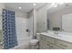 Standard bath with tub and shower combination with a patterned blue curtain at 1012 Autumn Meadow Ln, Wake Forest, NC 27587
